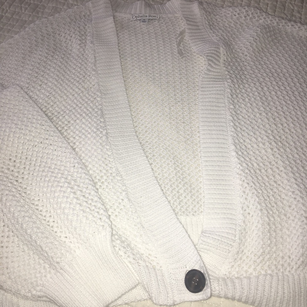 White knitted sweater with button